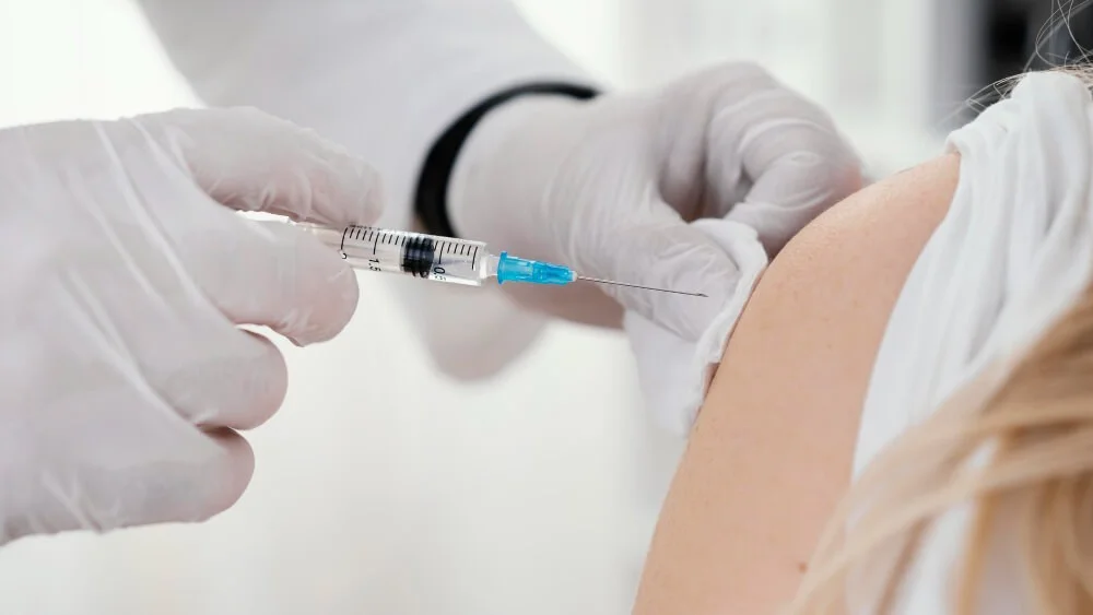 Vaccination on woman's arm